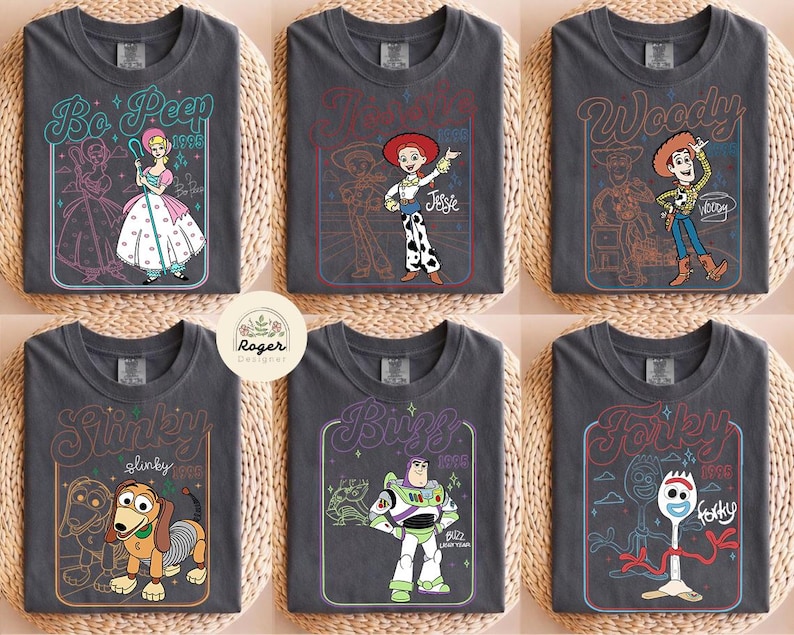 May include: A white ceramic mug with a black handle and the text "But First, Coffee" in a bold, black font. The mug is filled with a dark liquid, likely coffee, and rests on a light-coloured surface.