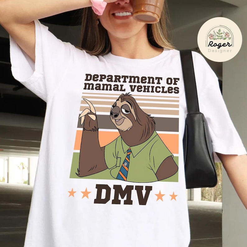 May include: White t-shirt featuring a cartoon sloth character in a green shirt and tie, with the text "DEPARTMENT OF MAMAL VEHICLES" and "DMV". The sloth is pointing upwards against a striped background.