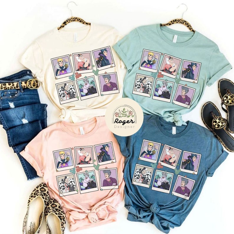 May include: Four different coloured t-shirts with a graphic print of a collage of Polaroid photos featuring Disney villains. The villains include Maleficent, Cruella de Vil, Ursula, and the Evil Queen.