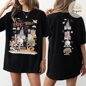 May include: A black t-shirt featuring a front graphic of Walt Disney World with characters including Mickey Mouse, Minnie Mouse, Donald Duck, and Goofy. The back graphic displays a vertical arrangement of park icons including the castle.