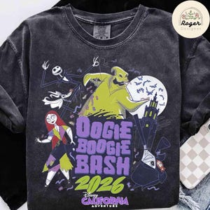 May include: A charcoal gray crew neck t-shirt featuring a graphic print of characters from The Nightmare Before Christmas, including Oogie Boogie, Jack Skellington, Sally, and Zero. The text reads Oogie Boogie Bash 2026 California Adventure.