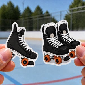 May include: Two die-cut stickers featuring black roller skates with white laces and bright orange wheels. One sticker shows a single skate in profile, while the other sticker displays a pair of skates angled to show the front and side details.