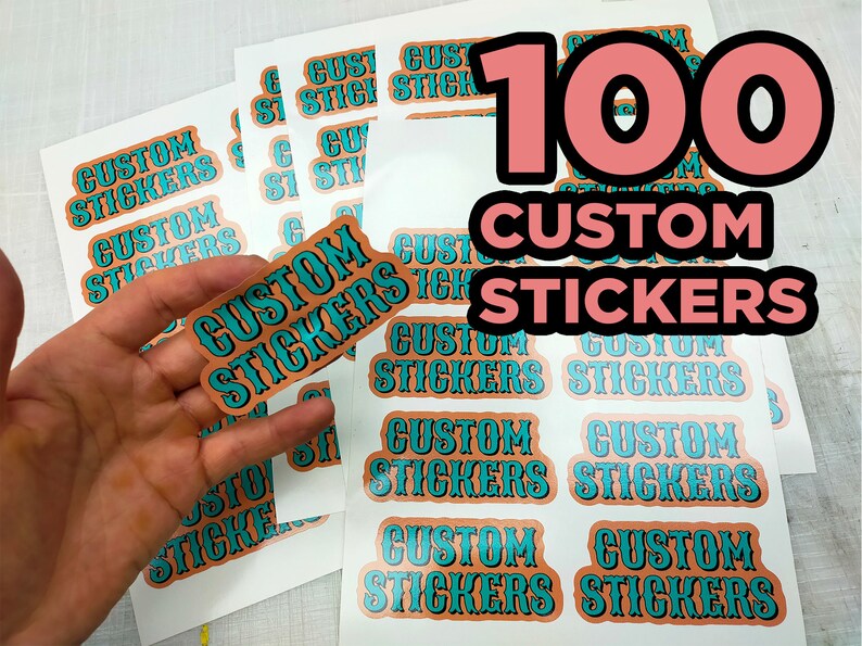 May include: Sheets of custom stickers with the text "CUSTOM STICKERS" in a turquoise and orange design. The number "100" is displayed in a large pink font. One sticker is held in a hand.