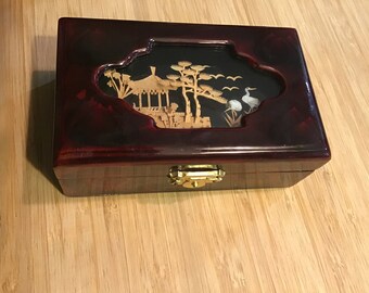 Beautiful handcrafted cork art with cranes encased in a small jewelry box lined in red.
