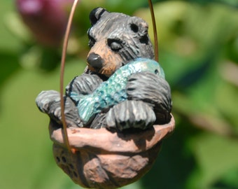 Sleeping black bear walnut ornament