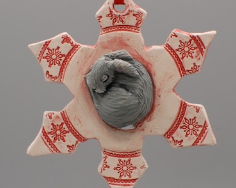 sleeping rabbit on a snowflake ornament