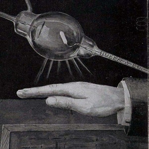 May include: A black and white illustration of a hand being exposed to a glass bulb with a wire attached. The bulb is labeled "QUEEN & CO."