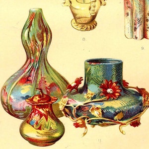 May include: Three decorative glass vases with floral designs. The vase on the left is green with a swirl pattern and pink and blue accents. The vase in the center is blue with a floral design and red accents. The vase on the right is gold with a floral design and red accents.