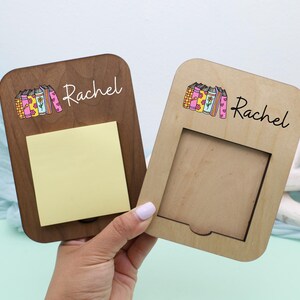 May include: Two wooden memo boards, one dark brown and one light brown, with a cutout and a sticky note pad. Each board has a colorful book illustration and the name "Rachel" in script.