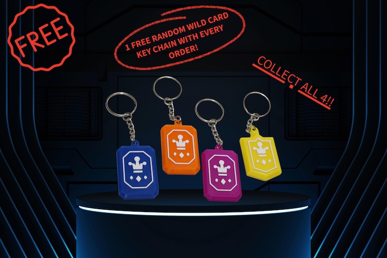 May include: Four keyrings in blue, orange, pink, and yellow, each with a crown design. The image includes the text "COLLECT ALL 4!!", "1 FREE RANDOM WILD CARD KEY CHAIN WITH EVERY ORDER!" and "FREE".