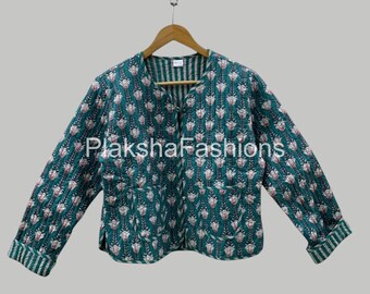 May include: A teal quilted jacket with a floral pattern and long sleeves. The jacket has a round collar and a button closure. The cuffs and inner collar feature a striped design. The text "Plaksha Fashions" is visible.