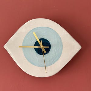 邪眼セラミック時計 – 手作りのモダンな青い目の壁掛けアート