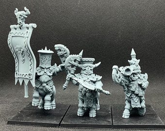May include: Three gray plastic miniature figurines of fantasy creatures riding on four-legged animals. The creatures are wearing helmets and armor and holding weapons. The figurines are on black bases.