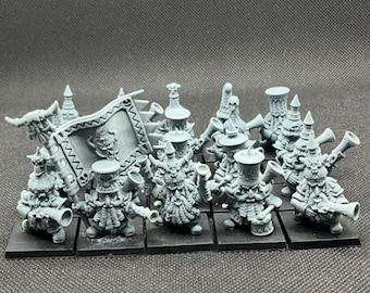 May include: A collection of gray miniature fantasy figures, each mounted on a black square base. The figures include dwarves with horns, beards, and trumpets, and one figure holding a banner. The miniatures are detailed and ready for painting.