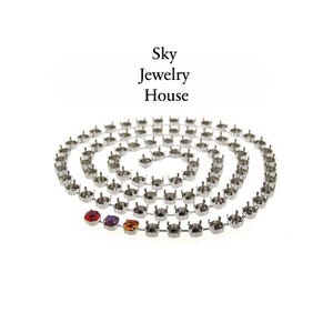 May include: A silver-toned metal cup chain for jewelry making, coiled in a spiral shape. The chain features empty prong settings for stones, with three small, colorful faceted stones set at the end. The text Sky Jewelry House is visible above.