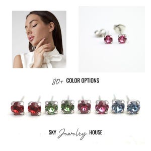 May include: A close-up of eight pairs of small stud earrings with different coloured gemstones. The earrings are silver and have a small, round gemstone in the centre. The gemstones are red, green, pink, and blue. The text "80+ COLOR OPTIONS" is displayed above the earrings. The text "SKY Jewelry HOUSE" is displayed below the earrings.