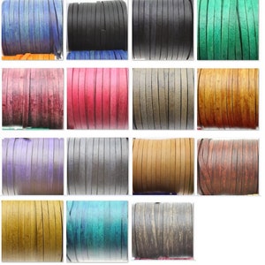 May include: Assortment of 12 colors of leather cord, each color is shown in a separate roll. The colors are blue, black, green, burgundy, red, brown, purple, gray, tan, teal, and gray with a distressed look.