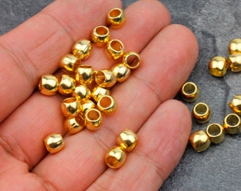 25 contas espaçadoras redondas banhadas a ouro 24k: ZAMAK com furo grande (7 x 5 mm) - zm730go