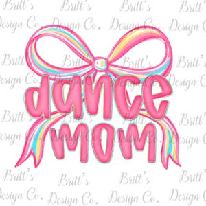 May include: A pink "Dance Mom" graphic with a rainbow-coloured bow. The text is in a bubble font with a gold outline. The bow has pink, yellow, and blue stripes. The design is on a white background.