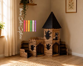 May include: A wooden cat castle with a tall tower, a pointed black roof, and arched doorways. The structure features cut-out silhouettes of witches and cats. Six colored markers are displayed vertically with the text More Color Options.