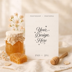 May include: A mock-up featuring a jar of honey with a gingham lid, a honeycomb, and a wooden honey dipper. A card with the text "Your Design Here" is also present. The image has a soft, warm aesthetic.