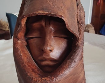 Ceramic face of a Sardinian woman made in the 1960s