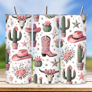 May include: Three stainless steel tumblers with a pink and green cactus, floral, and cowboy boot design. The tumblers are white with a pink and green pattern.
