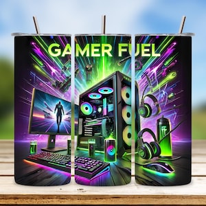 May include: A black and green gamer fuel tumbler with a design featuring a computer, headphones, and a controller. The tumbler has the words "Gamer Fuel" printed on it.