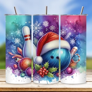 May include: Three stainless steel tumblers with a Christmas bowling theme. The tumblers feature a watercolor background with snowflakes, a bowling pin, a bowling ball, and a Santa hat.