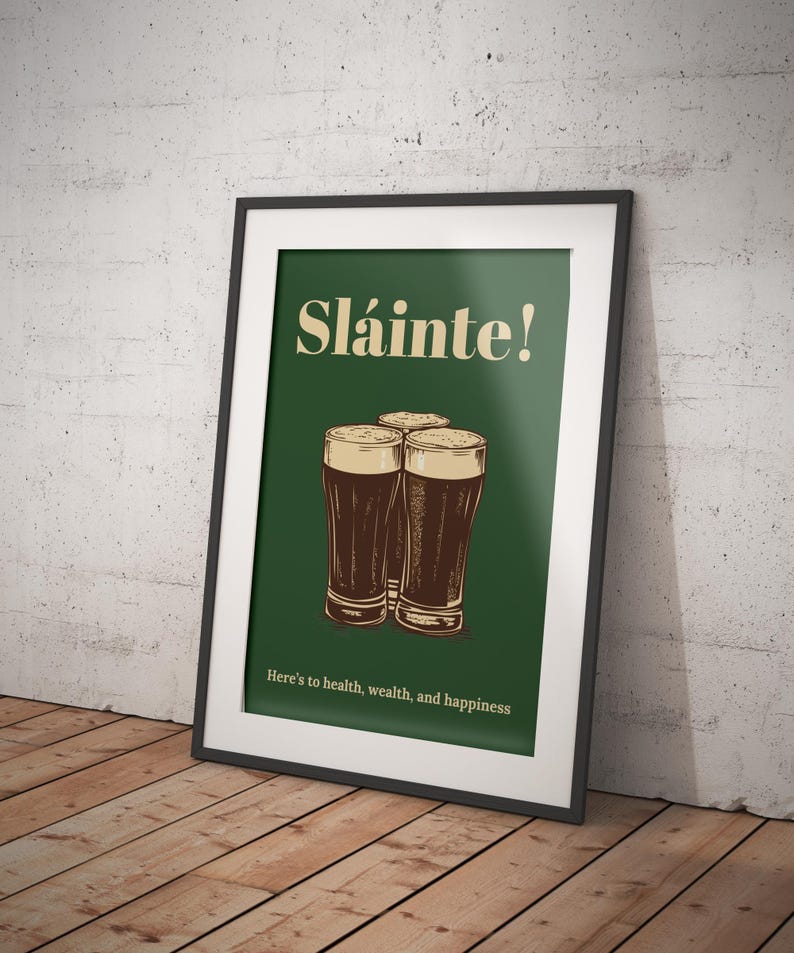 May include: A green poster with the text "Sl&aacute;inte!" in a yellow font. Three glasses of dark beer are arranged in a triangle shape. The text "Here's to health, wealth, and happiness" is at the bottom of the poster.