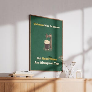 May include: A green poster with the text "Guinness May Be Scarce But Good Times Are Always on Tap". The poster features a cartoon illustration of a beer tap pouring a glass of Guinness.