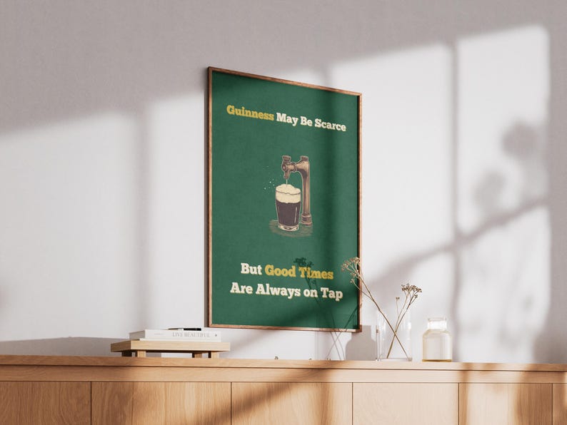 May include: A green poster with the text "Guinness May Be Scarce But Good Times Are Always on Tap". The poster features a cartoon illustration of a beer tap pouring a glass of Guinness.