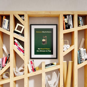 May include: A framed print with a green background and a glass of beer with a tap. The text on the print reads "Guinness May Be Scarce But Good Times Are Always On Tap".