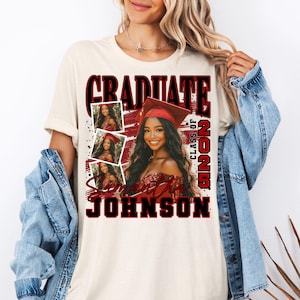 May include: A white t-shirt with a red and black graphic design that says "Graduate Class of 2023 Samantha Johnson". The graphic includes a photo of a woman wearing a graduation cap and gown.