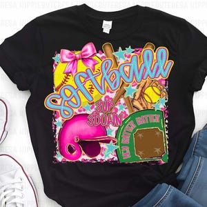 May include: Black t-shirt with a colorful graphic design featuring a softball, bats, a catcher's mitt, and the word "Softball" in blue and yellow letters.
