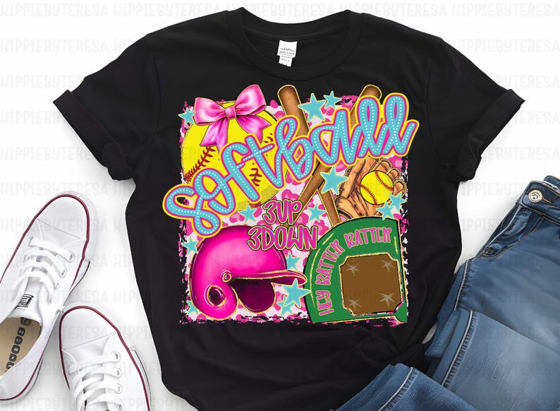May include: Black t-shirt with a colorful graphic design featuring a softball, bats, a catcher's mitt, and the word "Softball" in blue and yellow letters.