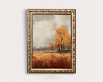 May include: A framed painting depicting a landscape with a single tree in the foreground. The tree is a vibrant orange and yellow, and the background is a muted grey and brown. The painting is framed in a gold frame.