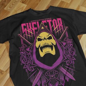 T-shirt Skeletor Masters of the Universe designs a vintage poster style.