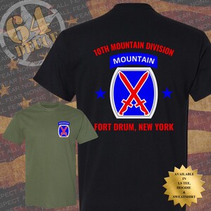 May include: Two t-shirts, one black and one olive green, featuring the 10th Mountain Division logo. The black shirt displays the logo on the back with text "10th Mountain Division, Fort Drum, New York." The olive shirt has the logo on the front.