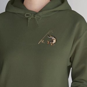 May include: A green hooded sweatshirt with a pocket on the front. The sweatshirt has an embroidered image of a fish on a fishing rod.