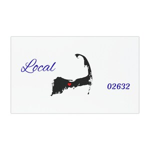 May include: A white rectangular card featuring the word "Local" in blue script, a black silhouette of a peninsula with a red heart, and the number "02632" in blue. The design is minimalist.