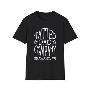 May include: Black t-shirt with the white text "TATTED DAD COMPANY" in a stylized font, with star accents. Below the text is "SHAWANO, WI". The shirt is a classic crew neck style.