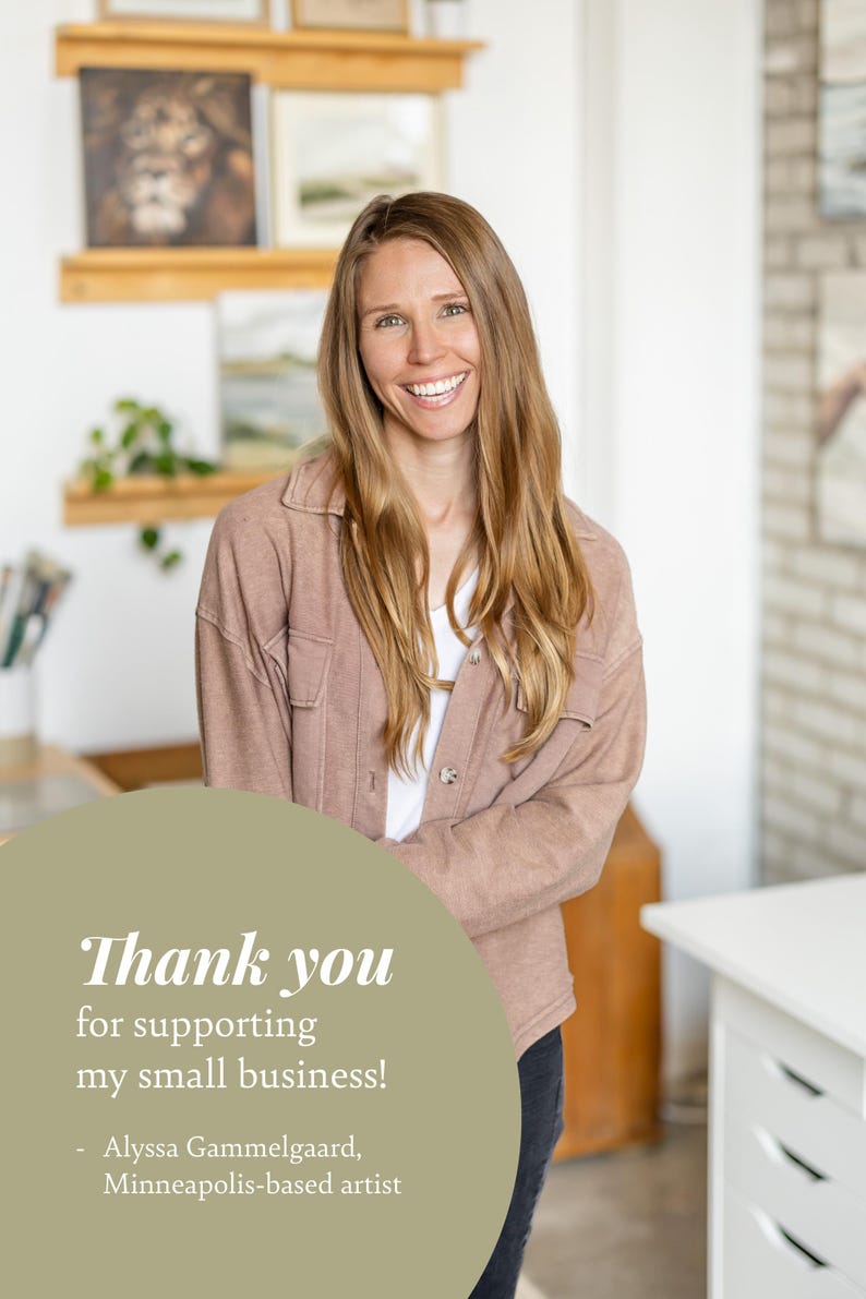 May include: A woman smiles and looks directly at the camera. She is wearing a light brown jacket and has long blonde hair. The text "Thank you for supporting my small business! - Alyssa Gammelgaard, Minneapolis-based artist" is on a light green circle.