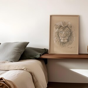May include: A framed drawing of a lion's face in shades of brown and beige, hanging on a white wall above a wooden shelf with two brown ceramic vases.