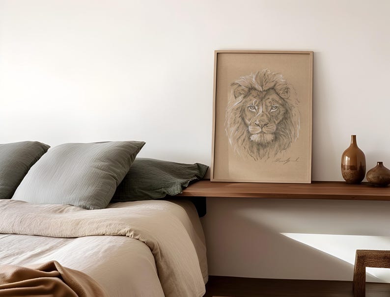 May include: A framed drawing of a lion's face in shades of brown and beige, hanging on a white wall above a wooden shelf with two brown ceramic vases.