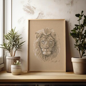 May include: A framed pencil drawing of a lion's head on a brown background. The lion has a thick mane and is looking directly at the viewer.