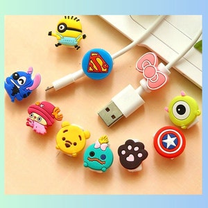 May include: Assortment of colorful cartoon character cable protectors.  The protectors feature characters like Stitch, Minnie Mouse, a paw print, and a superhero.
