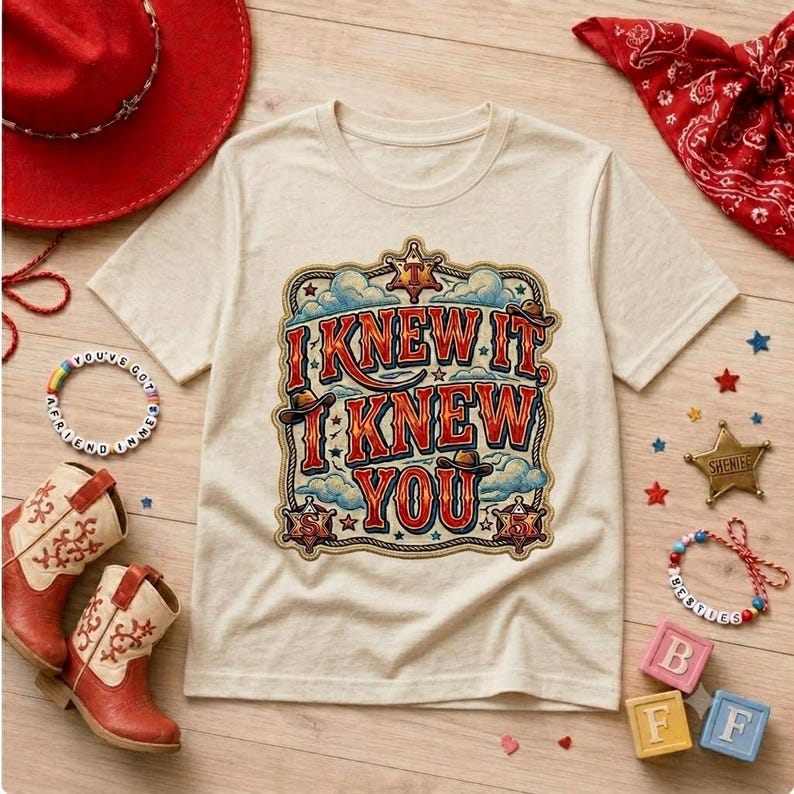 Retro western-style typography design featuring the phrase “I Knew It, I Knew You” in bold vintage red and orange lettering with blue shadows. The artwork includes cowboy hats, sheriff badges, stars, clouds, rope border details, and a rustic cowboy theme, making it ideal for a 5th birthday shirt, western birthday party, family matching apparel, and print-on-demand products.