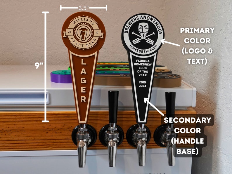 May include: Three beer tap handles with different designs. The left handle is brown with the text "Williams Craft Lager" and a beer glass logo. The middle handle is black with a silver tap. The right handle is black with the text "Brewers Anonymous Homebrew Club" and a skull and crossbones logo. The text "Florida Homebrew Club of the Year 2019 2023" is also on the right handle.