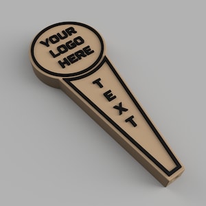 May include: A brown wooden beer tap handle with a black outline. The top of the handle is round and has the text "YOUR LOGO HERE" in black. The bottom of the handle has the text "TEXT" in black.